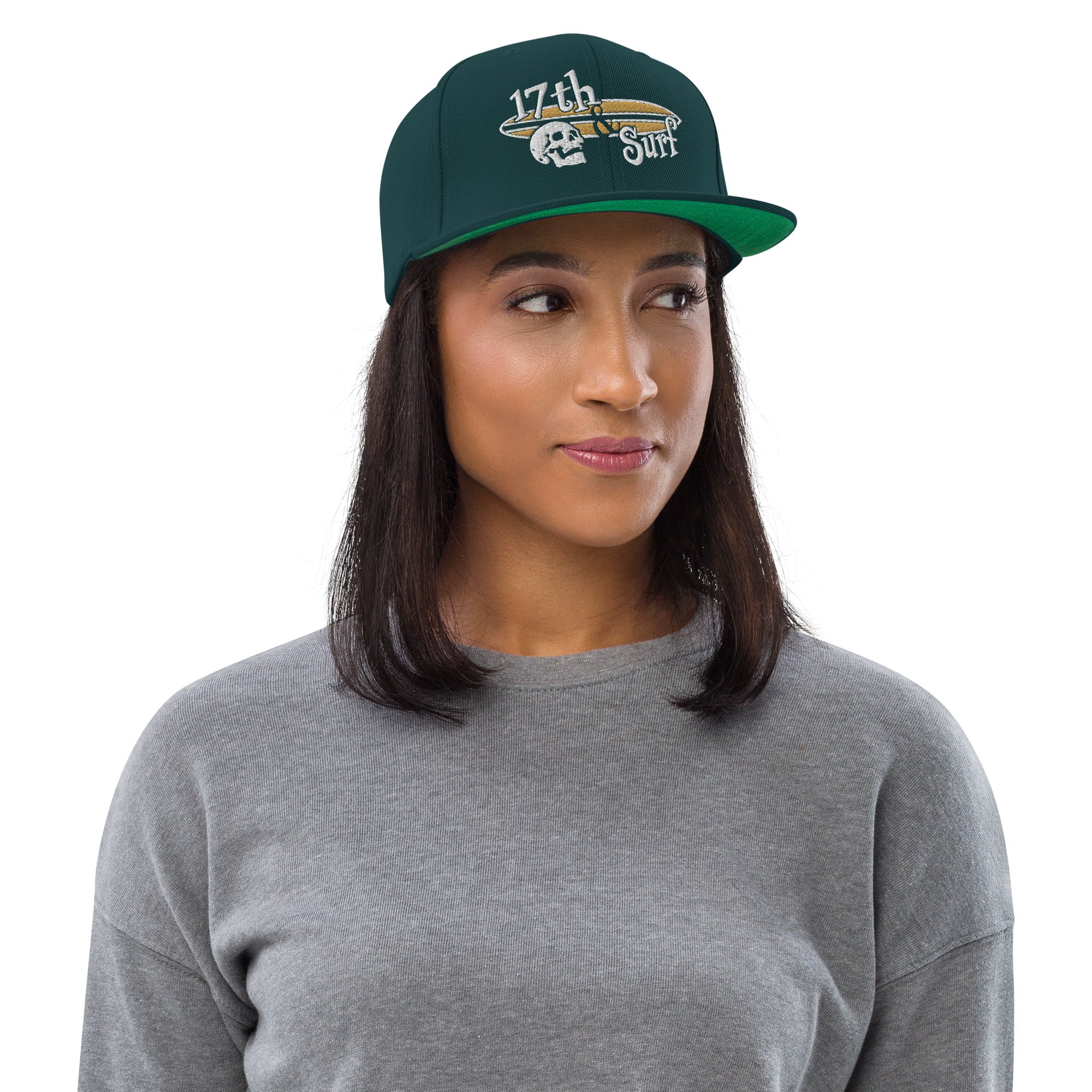 "Forever Waiting For The Next Wave" Spruce snapback hat, second front view, embroidered with the skull and surfboard logo from the meditating skeleton surfer design – Forever Waiting For The Next Wave Collection by 17th & Surf
