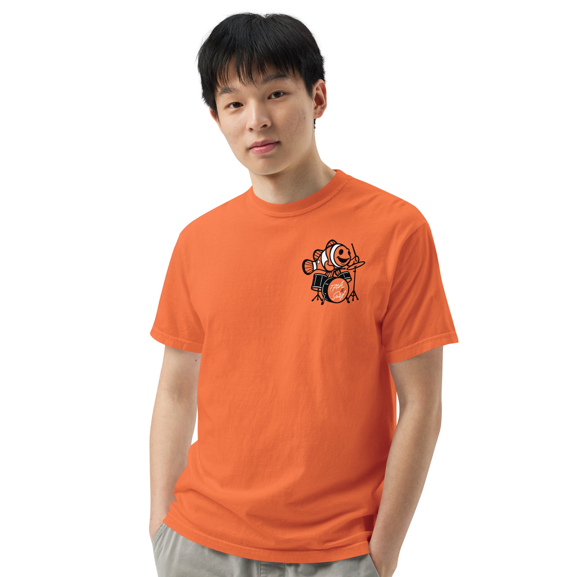 "I Started A Joke" garment-dyed heavyweight tee front view in burnt orange showing small clownfish-playing-drums chest logo – 17th & Surf