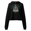"Take Time To Decompress" black cropped hoodie, front flat lay, featuring a meditating skeleton holding a glowing hourglass with a tiny silhouette inside, framed by a green geometric pyramid pattern with purple coral accents and gold ammonite shells, above a "Take Time To Decompress" banner – 17th & Surf