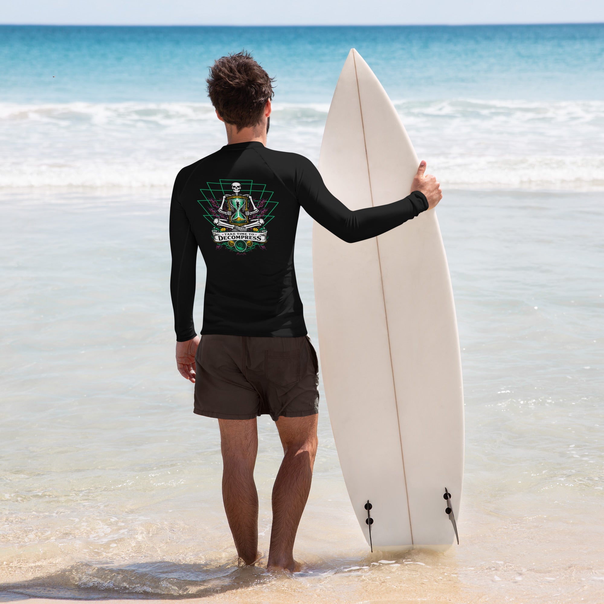 "Take Time To Decompress" white rash guard, back view, featuring a small gold and teal "17th & Surf" hourglass logo near the collar – 17th & Surf