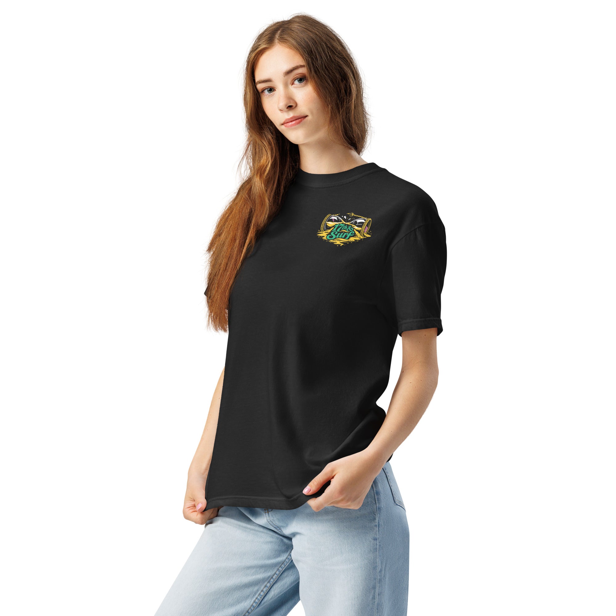 "Take Time To Decompress" black heavyweight t-shirt on female model, front 3/4 angle, featuring a small gold and teal "17th & Surf" hourglass logo on the left chest – 17th & Surf