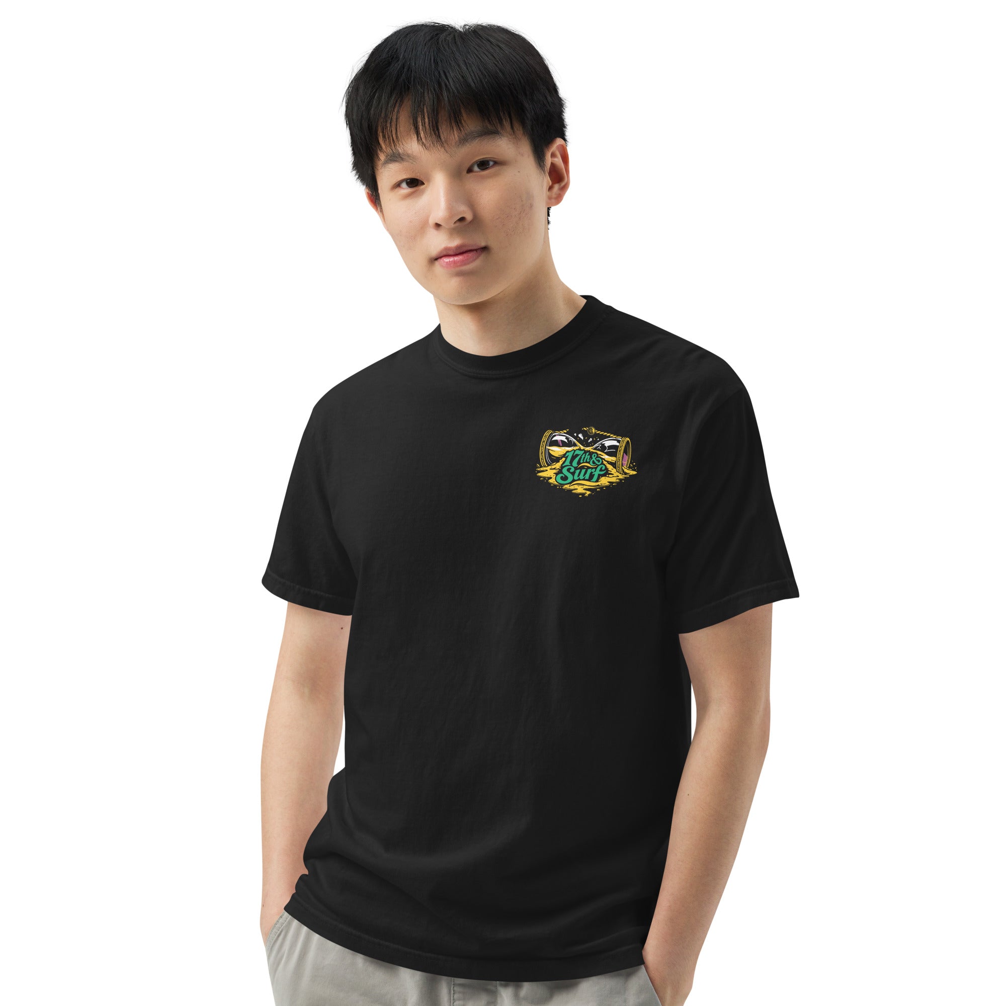 "Take Time To Decompress" black heavyweight t-shirt on male model, front view, featuring a small gold and teal "17th & Surf" hourglass logo on the left chest – 17th & Surf