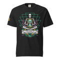 "Take Time To Decompress" black heavyweight t-shirt, front flat lay, featuring a meditating skeleton holding a glowing hourglass with a tiny silhouette inside, framed by a green geometric pyramid pattern with purple coral accents and gold ammonite shells, above a "Take Time To Decompress" banner, with a small gold and teal "17th & Surf" hourglass logo on the left sleeve – 17th & Surf