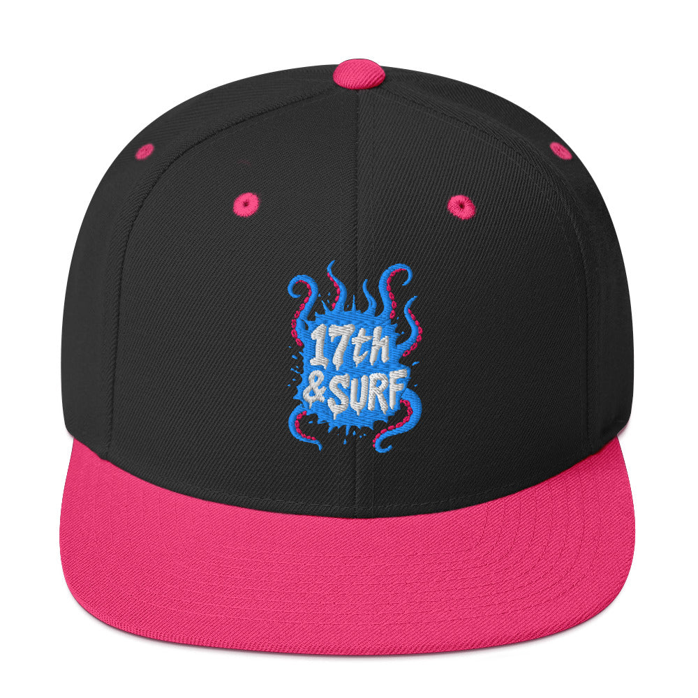 17th & Surf Tentacles snapback hat front view, black and neon pink hat with a blue and pink tentacle-themed "17th & Surf" logo – 17th & Surf