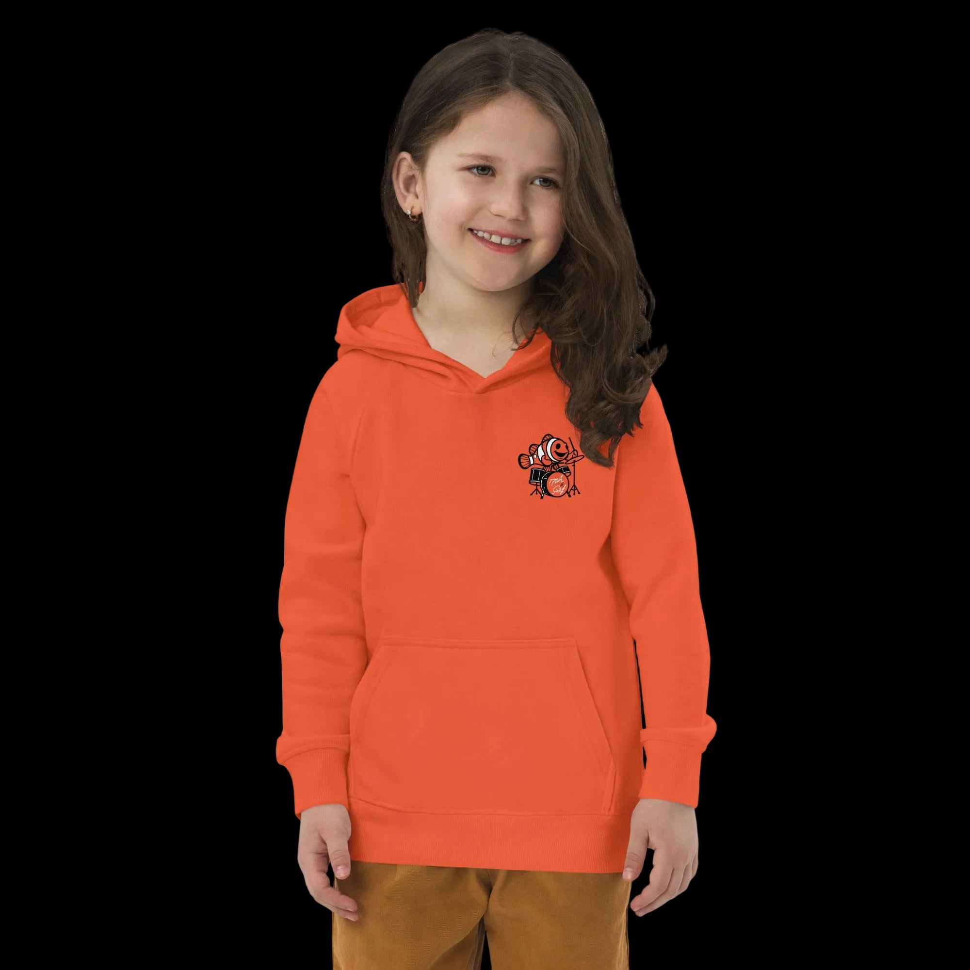 Girl wearing 17th & Surf burnt orange kids hoodie with small clownfish playing drums chest graphic
