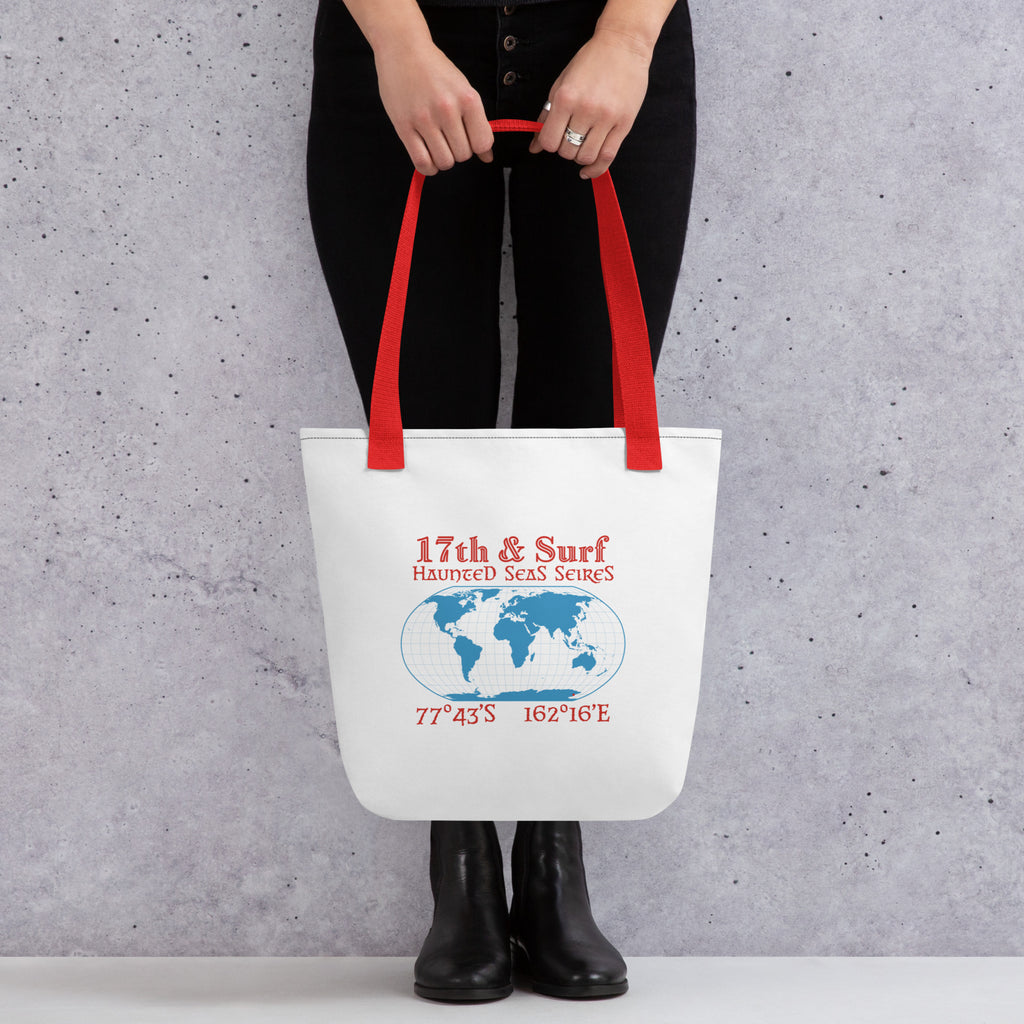 Model Holding Back of Blood Falls Antarctica tote bag featuring globe graphic and coordinates 77°43′S 162°16′E from the Haunted Seas Series by 17th & Surf