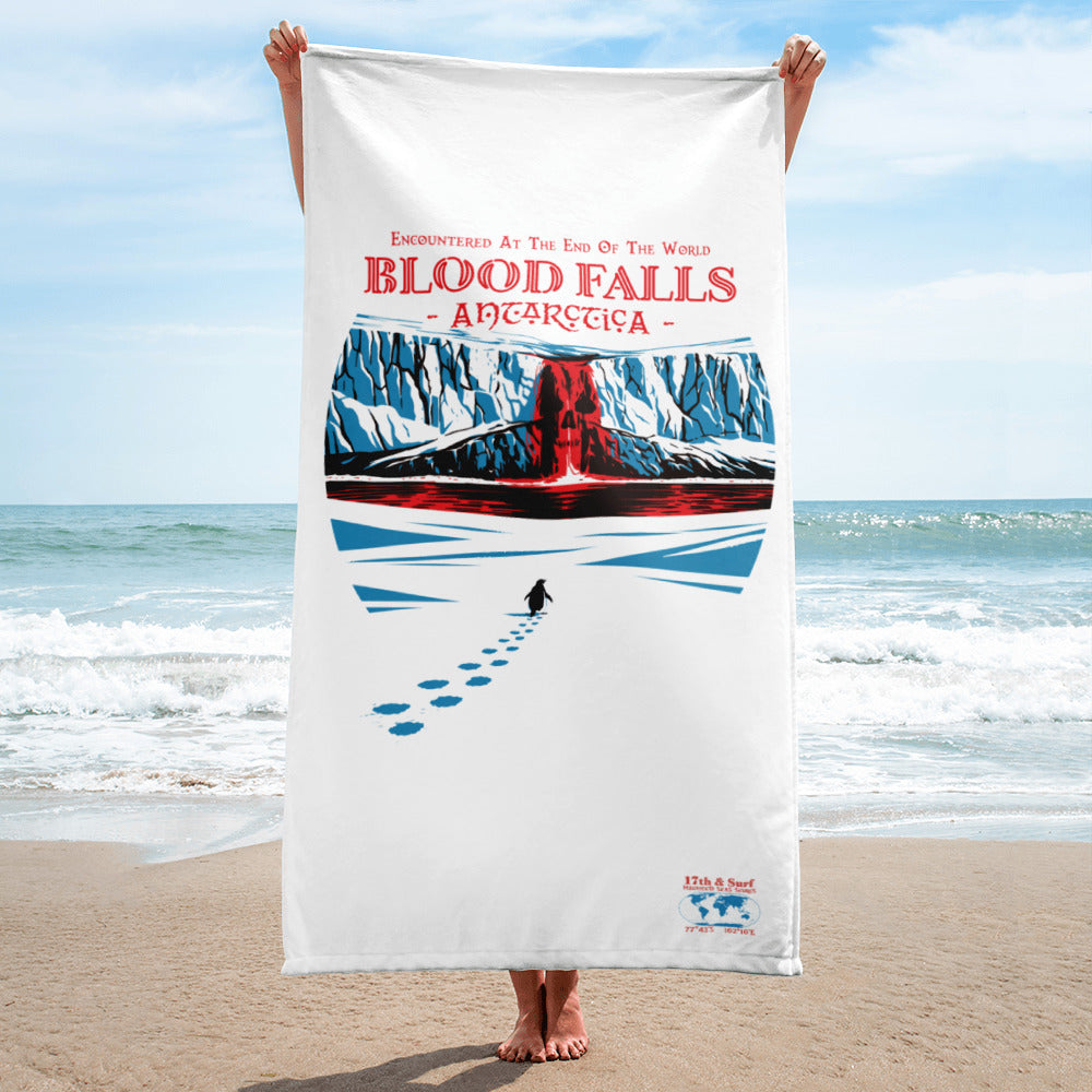 Person holding Blood Falls Antarctica beach towel with lone penguin approaching red glacier waterfall artwork inspired by Taylor Glacier (77°43′S 162°16′E) – Haunted Seas Series