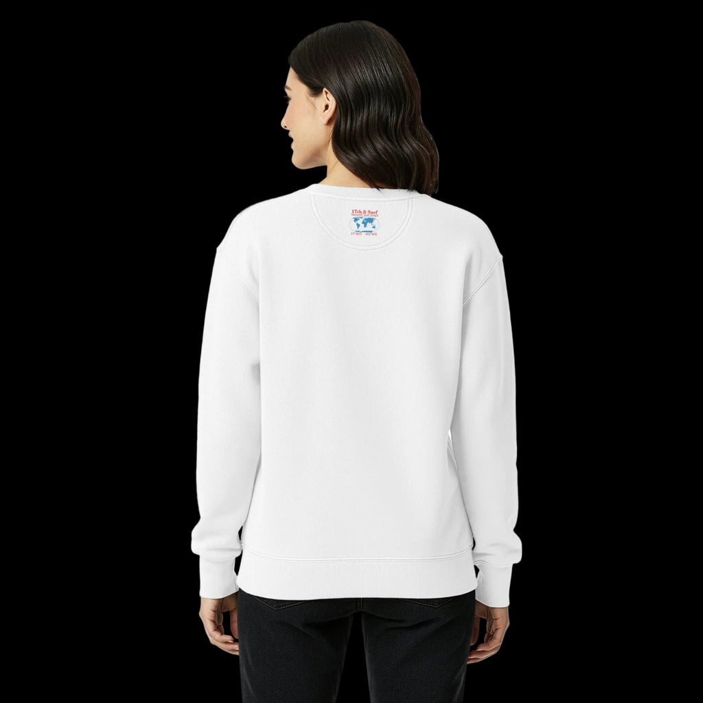 Woman wearing white sweatshirt with back design showing 17th & Surf Haunted Seas Series world map with Antarctica marked and 77°43′S 162°16′E coordinates